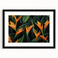 Elegant framed wall art featuring a botanical design of a vivid bird of paradise, showcasing lush colors and intricate details, perfect for home decor.