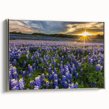 Framed canvas wall art featuring a vibrant bluebonnet botanical design, with silver frame accents, showcased at an angle to highlight its elegant presentation and detailed floral illustration. Perfect for adding a touch of nature-inspired decor to any space.