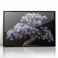 Framed wall art featuring a botanical bonsai tree design, showcasing vibrant flowers with a sleek black frame, perfect for modern home decor.