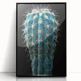 Framed wall art featuring a botanical cactus design with vibrant colors, set in a sleek black frame, ideal for modern home decor and nature enthusiasts.