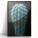 Framed wall art featuring a botanical cactus design with vibrant colors, set in a sleek black frame, ideal for modern home decor and nature enthusiasts.