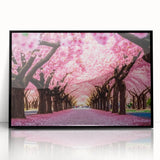 Framed acrylic wall art showcasing an intricate cherry blossom design in soft pink and white hues, set against a sleek black frame, perfect for modern decor.
