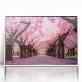 Framed wall art featuring a botanical cherry blossom design with vibrant pink flowers on a white background, elegantly showcased from the front view.