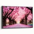 Framed canvas wall art showcasing a detailed cherry blossom botanical design in soft pink and white hues, presented in a sleek black frame for modern decor.