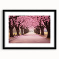 Framed botanical wall art showcasing a delicate cherry blossom design in soft pink and white hues, set against a sleek black mat, ideal for home decor.