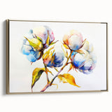 Framed botanical wall art featuring a vibrant floral design on cotton canvas with a gold frame, displayed at an angle to highlight its elegance and texture.