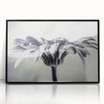 Framed wall art showcasing a botanical daisy design in vibrant colors, featuring a sleek black frame. Ideal for enhancing home decor with a touch of nature.
