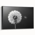 Framed black canvas wall art featuring a detailed botanical dandelion design, showcasing intricate textures and vibrant colors, ideal for modern home decor.
