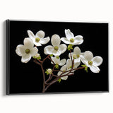 Framed wall art featuring a botanical dogwood design on canvas, showcasing vibrant flowers and intricate details against a sleek black frame, ideal for home decor.