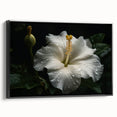 Framed canvas wall art showcasing a vibrant hibiscus botanical design with a black frame, ideal for home decor. Perfect for adding a tropical touch to living spaces.