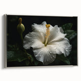 Framed wall art featuring a vibrant botanical hibiscus design on canvas, showcasing rich colors and intricate details, set against a sleek silver frame for an elegant display.