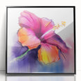 Framed wall art featuring a botanical hibiscus design in vibrant colors, set in a sleek black frame, ideal for home decor and floral-themed spaces.