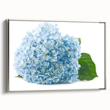 Framed botanical wall art showcasing a vibrant hydrangea design on textured canvas, elegantly bordered in silver, ideal for enhancing home decor.