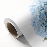 Rolled canvas print showcasing an elegant hydrangea botanical design, featuring soft blue and pink hues, perfect for home decor and adding a touch of nature indoors.