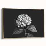 Framed canvas wall art showcasing a botanical hydrangea design, featuring delicate blue and cream flowers with a sleek gold frame, ideal for home décor.