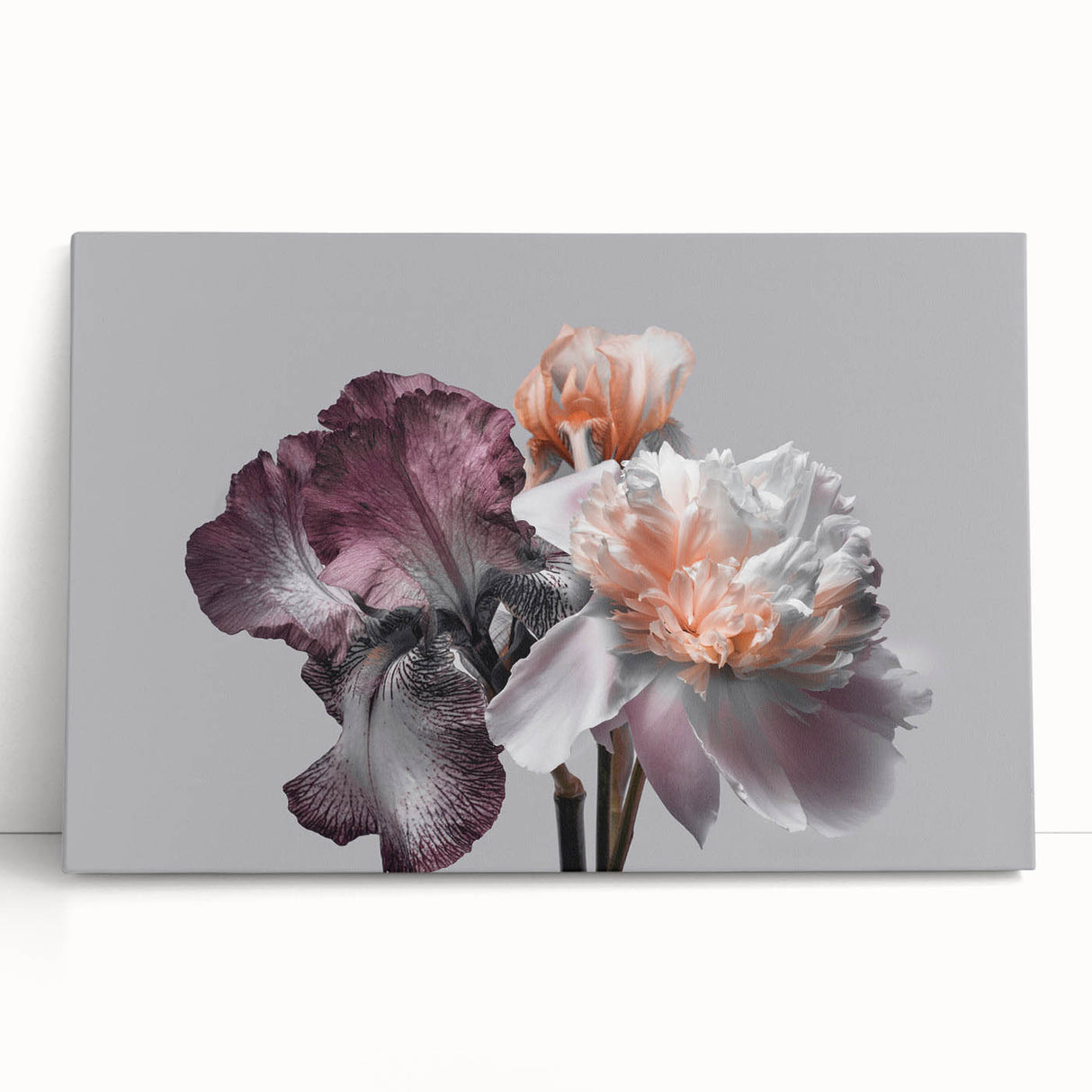 Stretched canvas wall art depicting a vibrant botanical iris design in soothing blue and green hues, elegantly leaning against a neutral backdrop, perfect for home decor.