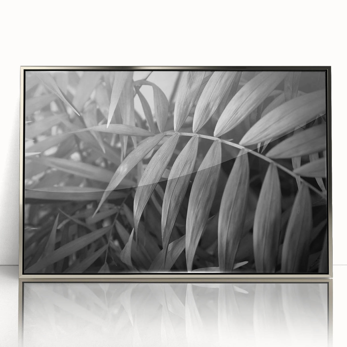 Framed acrylic wall art featuring a botanical design of vibrant flowers and leaves, elegantly displayed with a silver frame, perfect for home decor.
