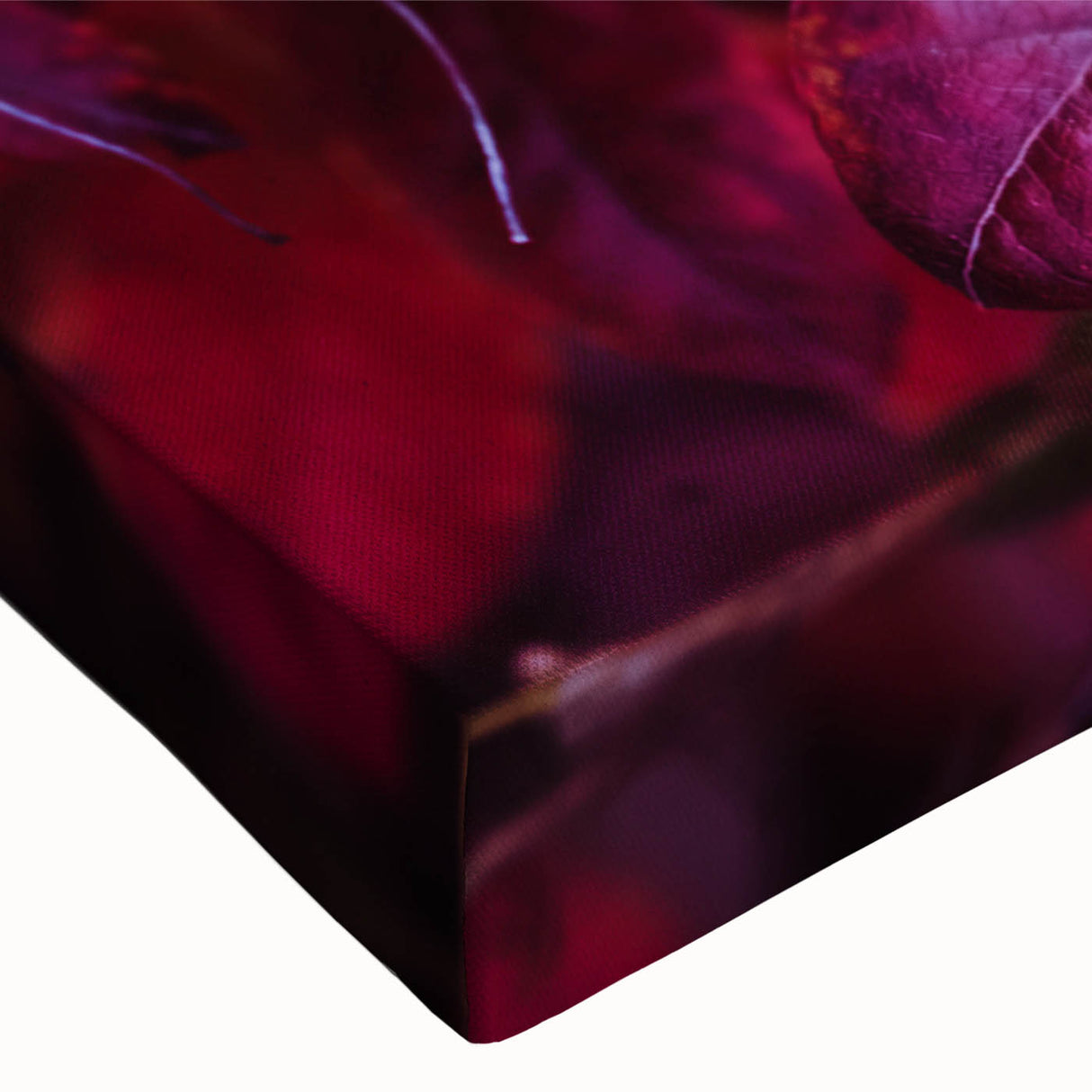 Close-up of a vibrant botanical leaves design on stretched canvas, showcasing intricate details of various flowers in rich colors, perfect for home decor.