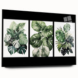 Acrylic glass wall art featuring a botanical design of vibrant flowers and lush green leaves, displayed elegantly from a side view, perfect for home decor.