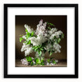 Black-framed wall art featuring a botanical design of lilacs, elegantly matted, showcasing vibrant purple flowers against a clean white background, perfect for floral decor.