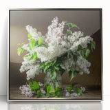 Framed wall art featuring a botanical design of lilacs in shades of purple and green, elegantly displayed with a silver frame, perfect for home decor enhancement.