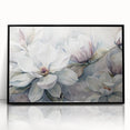 Framed wall art showcasing a botanical design of magnolia flowers in vibrant colors, featuring a sleek black frame that enhances its elegance. Ideal for home decor.
