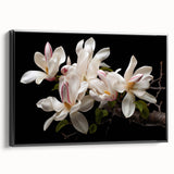 Framed black canvas wall art depicting a botanical magnolia design, showcasing intricate floral details and elegant colors, perfect for home decor enhancement.