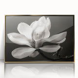 Framed wall art featuring a botanical magnolia design with a gold-accented frame, showcasing vibrant floral details against a clean background, perfect for home decor.