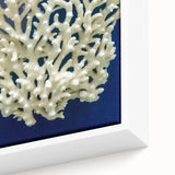 Close-up of a framed canvas wall art featuring a vibrant botanical design of marine plants in shades of blue and green, showcasing intricate details and textures. Ideal for enhancing coastal home decor or nature-themed interiors.