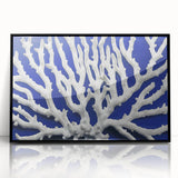 Framed wall art featuring a botanical design of marine plants, showcasing vibrant colors and intricate details, set in a sleek black frame for modern decor.