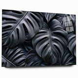 A side view of a botanical Monstera wall art design showcasing vibrant green leaves set against a clean background, displayed in an acrylic glass frame for a modern aesthetic. Ideal for home decor enthusiasts seeking tropical-themed artwork.