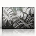 Framed acrylic wall art showcasing a vibrant Monstera plant design on a black background, perfect for modern decor. Ideal for botanical enthusiasts looking to enhance their home aesthetic.