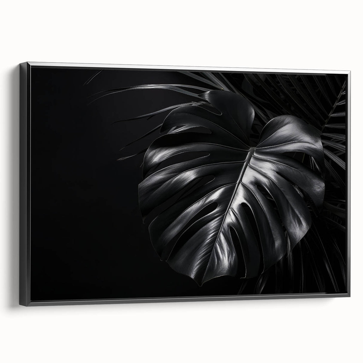 Framed canvas wall art featuring a botanical monstera design with vibrant green leaves on a black background, showcasing a modern aesthetic for home decor.