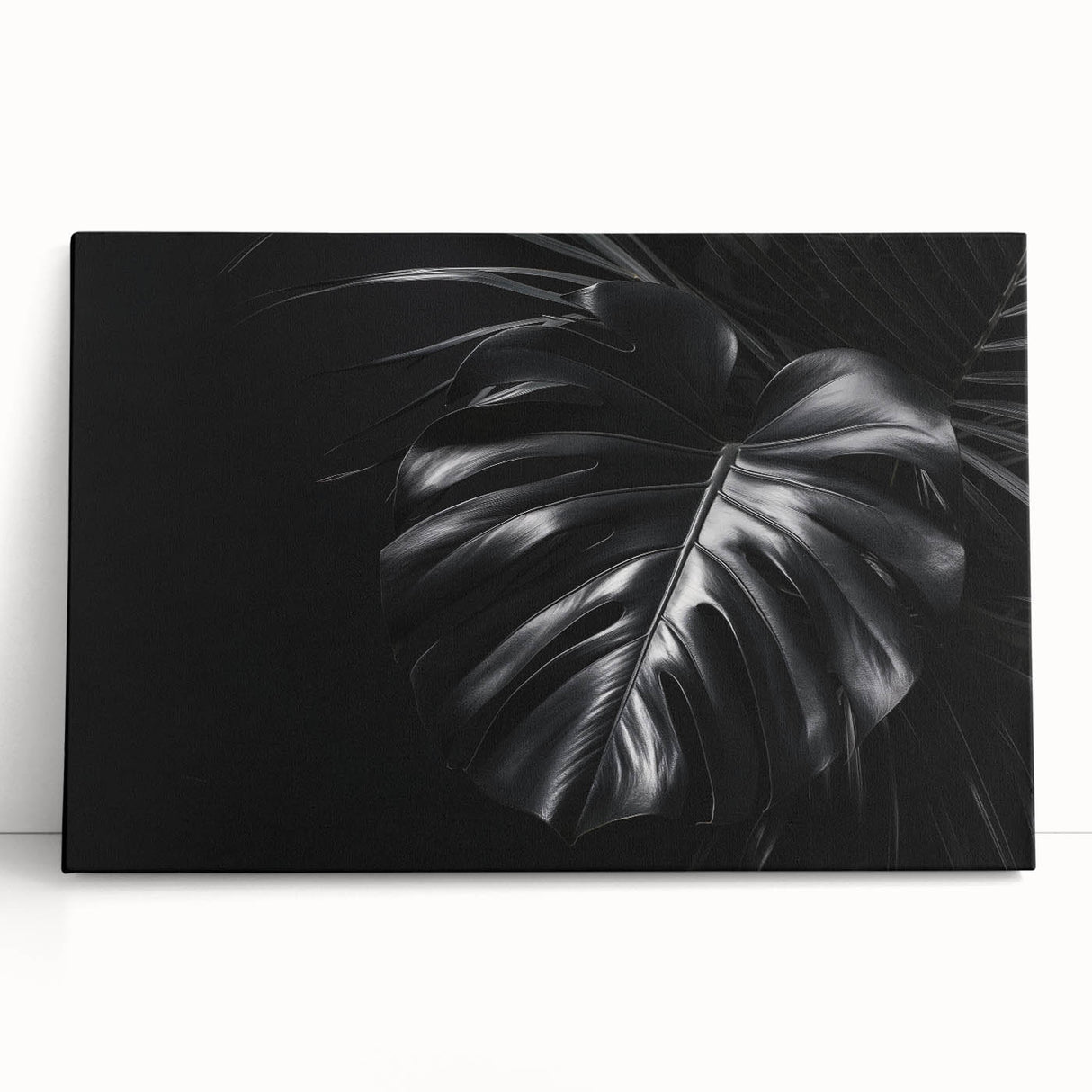 Botanical wall art featuring a vibrant monstera leaf design on stretched canvas, showcasing rich green hues and detailed textures, perfect for enhancing home decor.