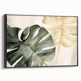 Framed botanical wall art featuring a Monstera plant design, presented in a sleek black frame with a side view showcasing its textured canvas surface. Ideal for modern home decor.