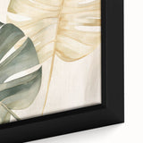 Close-up of a framed canvas wall art piece showcasing a vibrant monstera leaf design, featuring rich green hues and intricate botanical details, perfect for home decor.