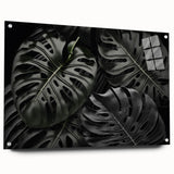 Botanical wall art collection featuring a side view of a Monstera design printed on acrylic glass, showcasing vibrant green leaves and elegant mounting pins for display.