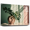 Acrylic glass wall art piece showcasing a vibrant monstera botanical design, elegantly displayed from the side with visible pins, perfect for modern decor.