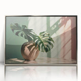 Framed acrylic wall art featuring a vibrant botanical monstera design, with silver accents and a sleek front view, perfect for modern home decor.