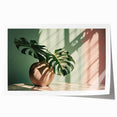 Botanical art print featuring a vibrant monstera leaf design on a textured background, rolled and ready for display, ideal for home decor enthusiasts.