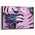Framed canvas wall art showcasing a botanical monstera design, featuring vibrant green leaves on a black background, viewed from the side, ideal for modern decor.