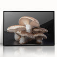 Framed wall art featuring a botanical design of colorful mushrooms and flowers, displayed with a sleek black frame, ideal for adding a touch of nature to home decor.