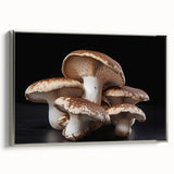 Framed wall art featuring a botanical design of vibrant mushrooms on canvas, elegantly displayed with a silver frame, perfect for enhancing modern home decor.
