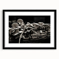 Botanical wall art featuring an elegant design of colorful flowers and mushrooms, framed in a sleek black frame with a mat, perfect for home decor.