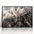 Framed wall art showcasing a botanical design of colorful flowers and mushrooms, with a sleek black frame, perfect for adding a touch of nature-inspired decor to any room.