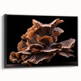 Framed botanical wall art featuring an intricate design of colorful mushrooms and flowers on a black background, showcasing a side view of the canvas. Perfect for nature-inspired decor.