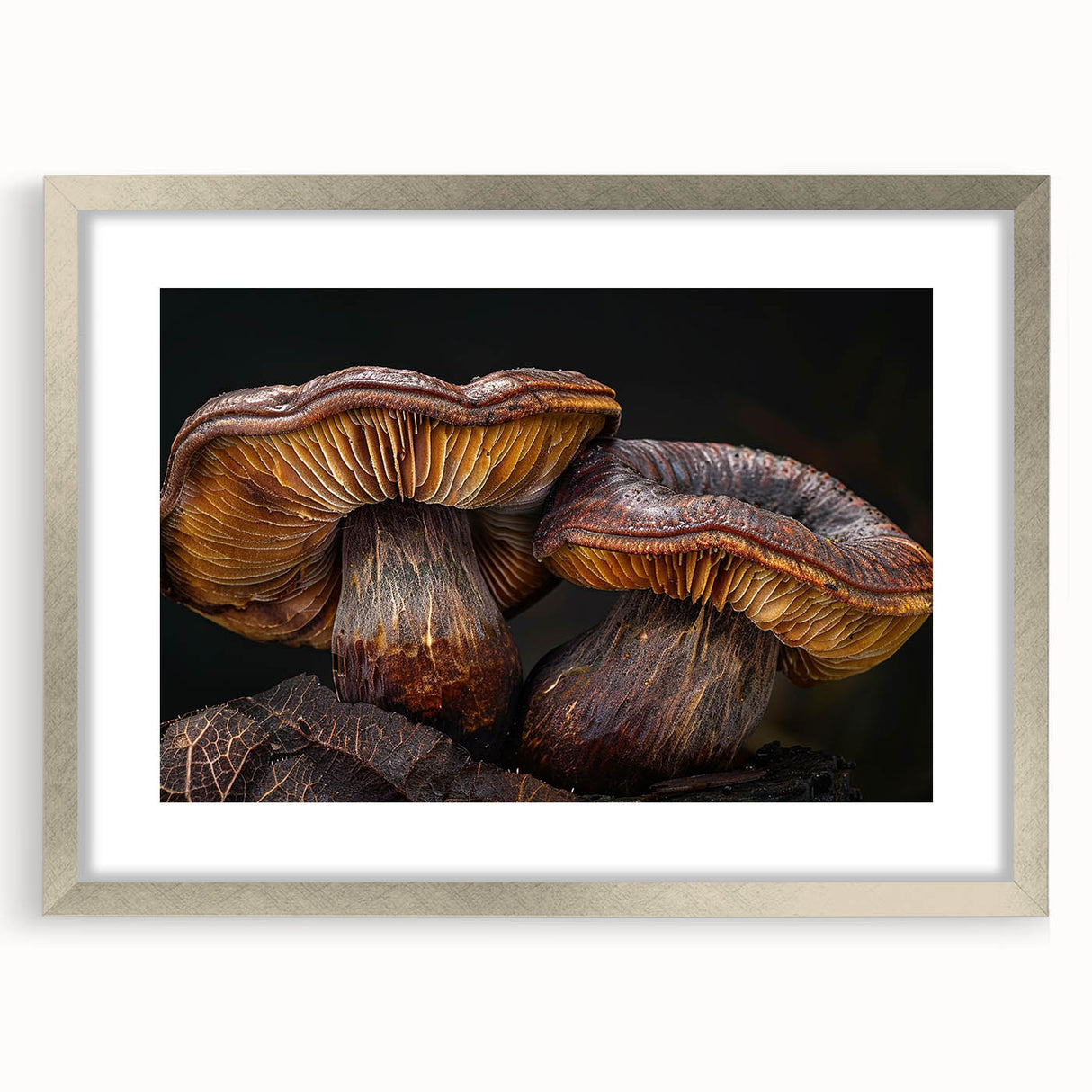 Framed botanical wall art featuring a design of vibrant flowers and mushrooms, accented with a silver frame and mat, ideal for enhancing home decor.