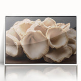 Framed wall art featuring a botanical design of colorful mushrooms and flowers, presented in a sleek white frame, perfect for home decor and nature enthusiasts.
