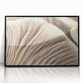 Framed wall art featuring a botanical design of colorful flowers and mushrooms, presented in a sleek black frame, adding a vibrant touch to home decor.
