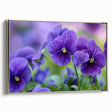 Framed botanical wall art featuring a vibrant pansy design in shades of purple and yellow, elegantly presented with a silver frame for a modern touch. Perfect for enhancing home decor.